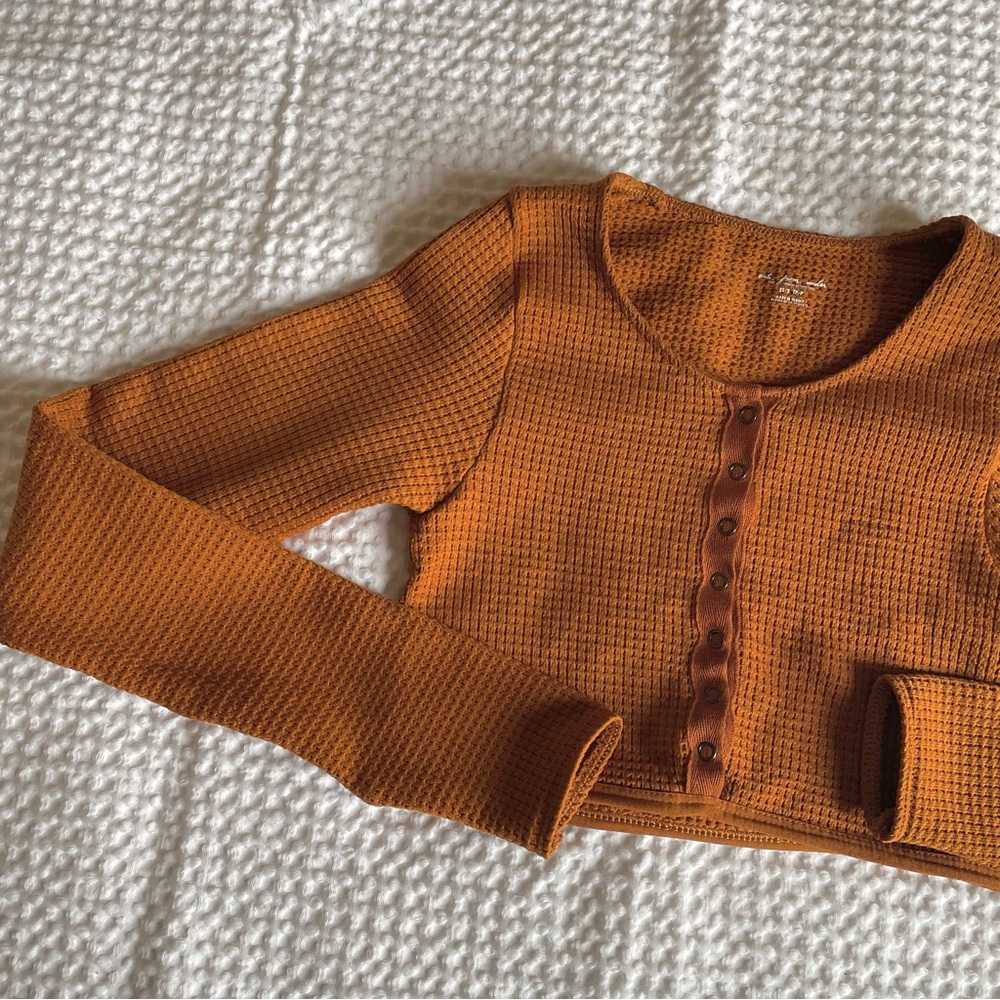 Brown/ rust waffle knit long sleeve cropped henley shirt from Urban Outfitters